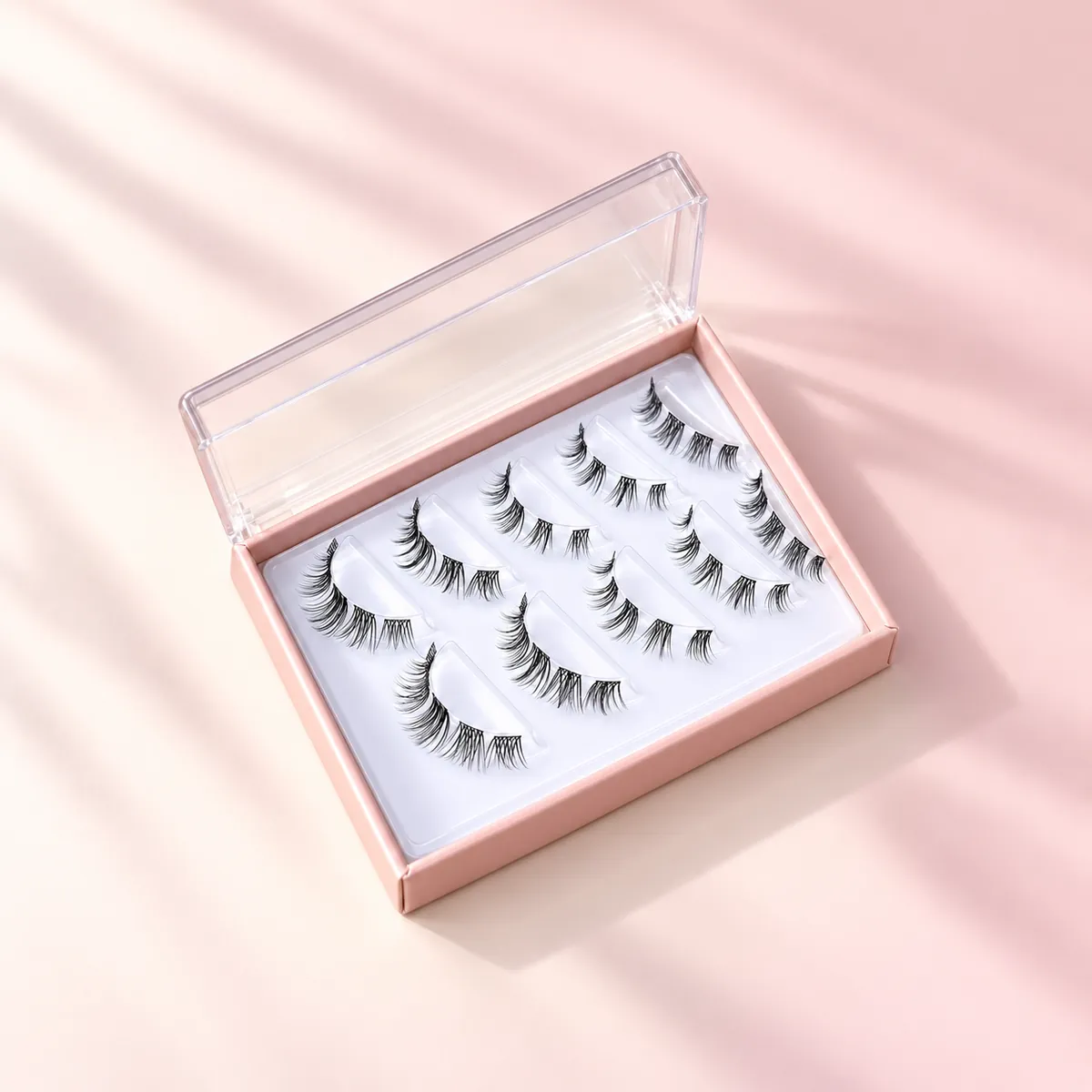 Three-row segmented cluster lash tray in a pink presentation box