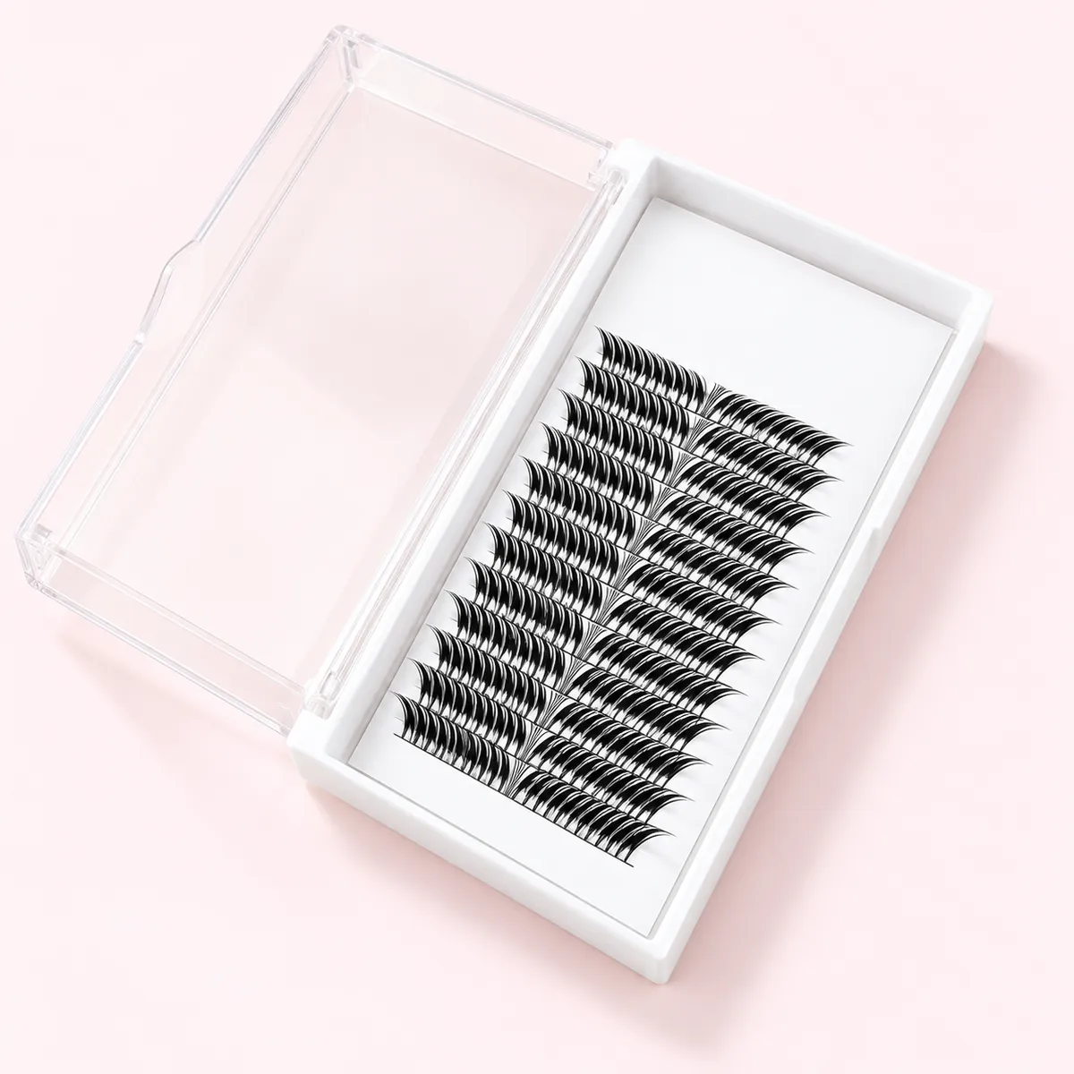 White professional lash tray with straight rows of small black premade fans