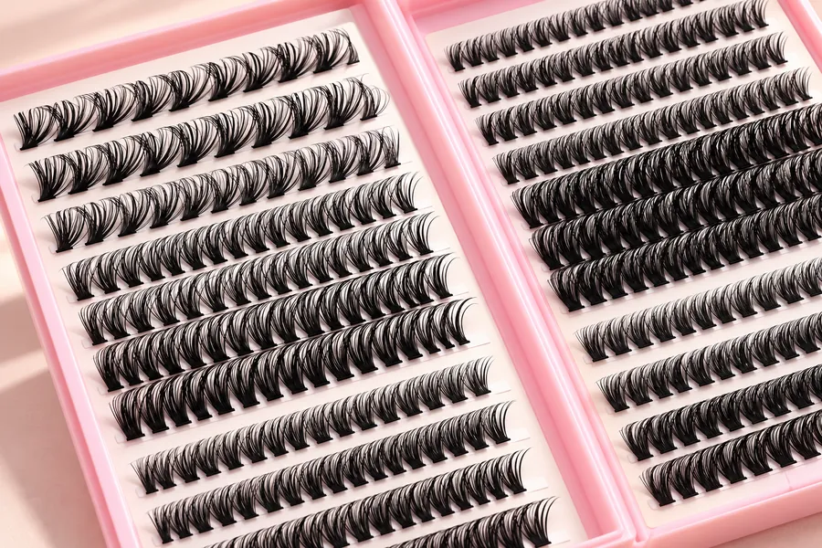 Close view of separated spiky clusters and short bases inside a pink lash book