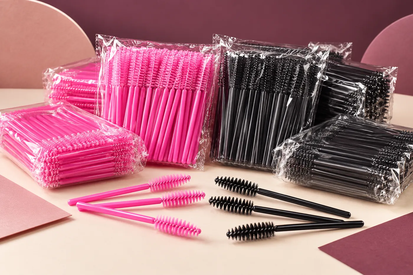 Pink and black spoolie wands in loose examples and transparent bundled packs