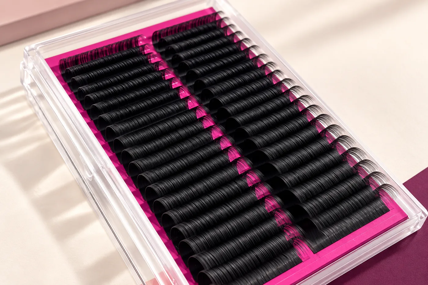 Angled close view of black professional lash rows and their curved profiles